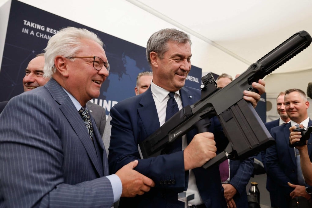 Bavaria’s state Premier Markus Soeder holds a grenade launcher as Rheinmetall’s CEO Armin Papperger (left) watches during a ceremony in southern Germany last month. Photo: AFP