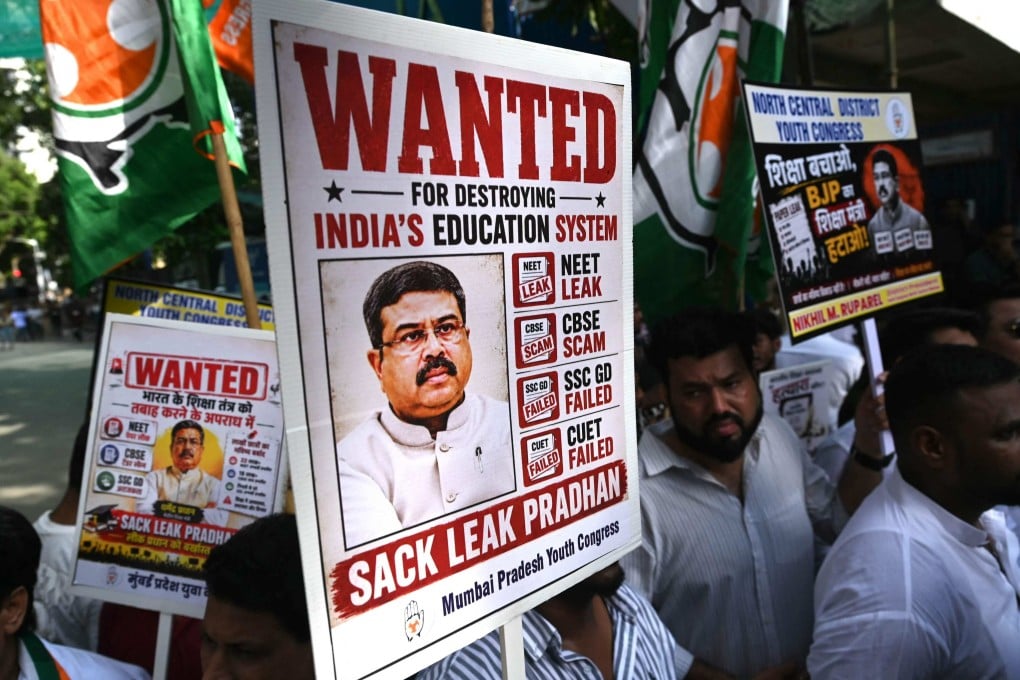 Indian Youth Congress party workers hold placards featuring India’s education minister Dharmendra Pradhan during a protest over the alleged national medical school entrance exam irregularities, in Mumbai on June 2. In July, Pradhan announced his resignation after countrywide protests. Photo: AFP