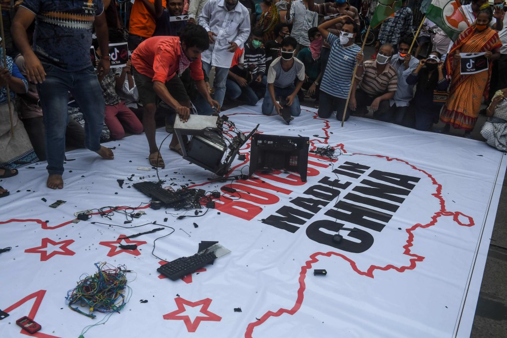 Protesters destroy Chinese goods in Kolkata, India, on June 18, 2020, soon after the countries’ militaries clashed on their border. Photo: AFP