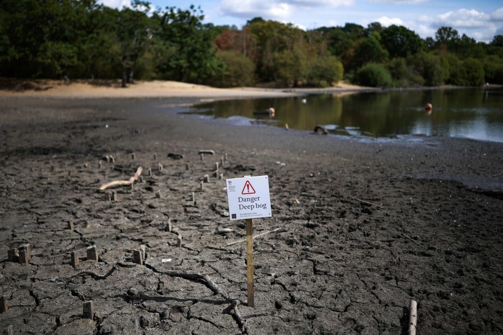The dried and cracked bed of a depleted pond near Wanstead in east London on Monday, where the area’s water services are managed by Thames Water. Over half of England has been declared to be in a drought. Photo: AFP