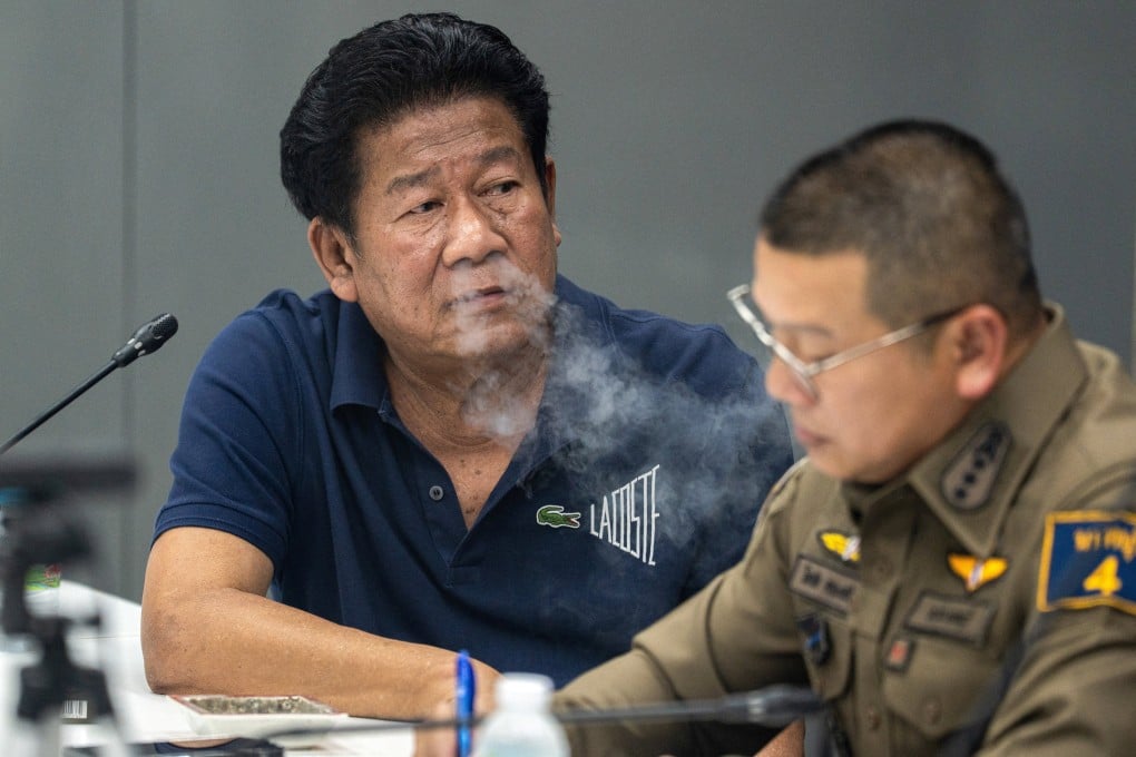 Former MP Chalong Riewrang is questioned by police after he allegedly shot and killed provincial official Thongchai Yenprasert on the outskirts of Bangkok on Monday. Photo: Reuters