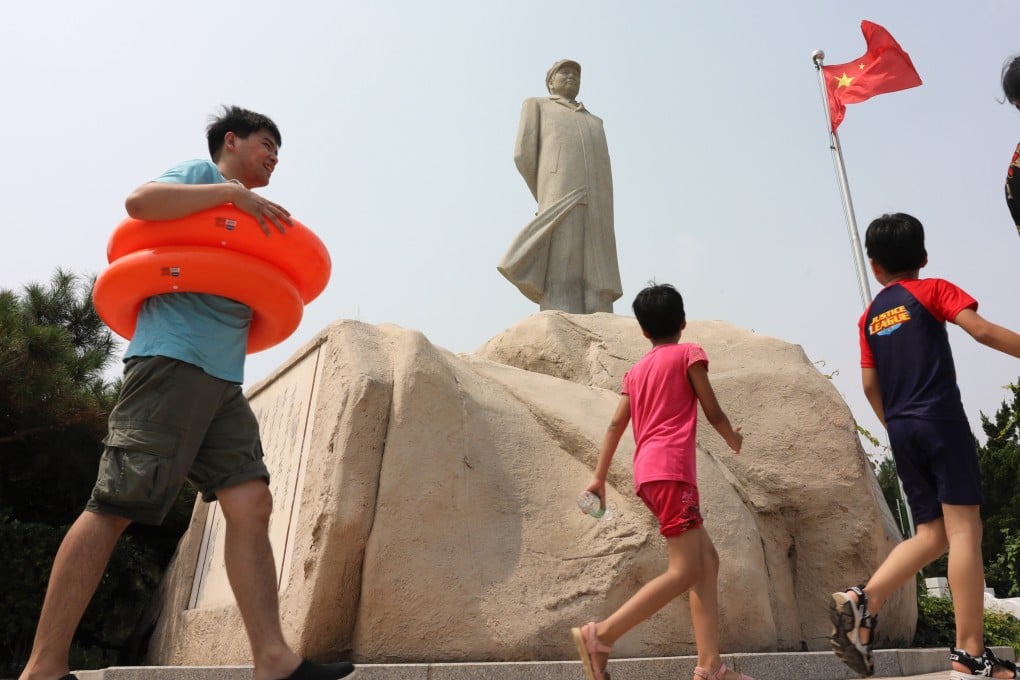 Visitors walk past a statue of Mao Zedong in Beidaihe, in northern Hebei province. Chinese leaders have travelled to the seaside town every year since the 1950s. Photo: Simon Song