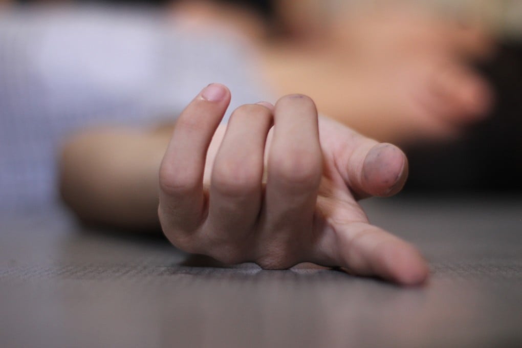 A victim lies on the floor. A 62-year-old woman is in critical condition after being set on fire on Sunday. Photo: Shutterstock
