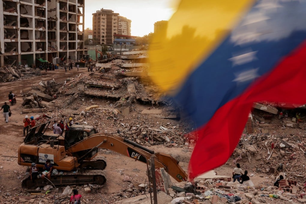 A Venezuelan flag waves as people search for bodies in Caraballeda, La Guaira, after earthquakes in June. Israel sent aid to Venezuela following the earthquakes. Photo: Reuters