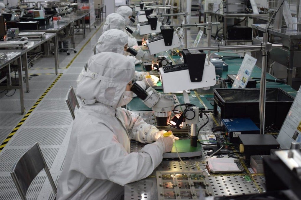 Workers at Cloud Light’s factory in Dongguan, Guangdong province. Cloud Light manufactures fibre optic transceivers, a device used in data centres to send data over fibre optic cables. Photo: Handout