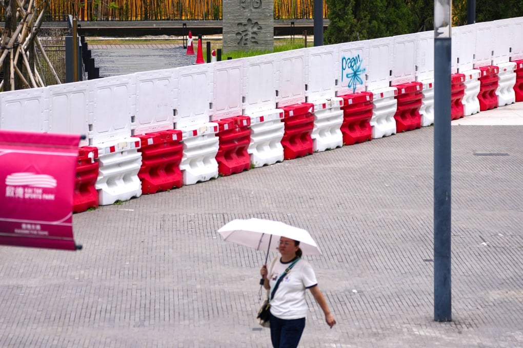 A woman walks through the Kai Tak neighbourhood on August 11. Photo: Karma Lo