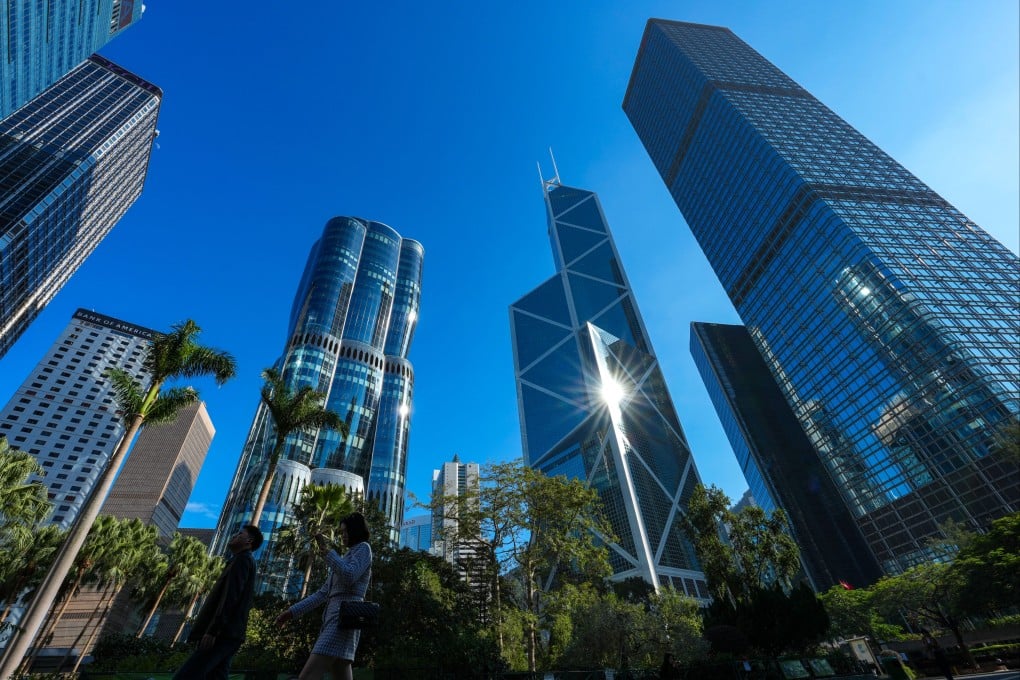 People walk past skyscrapers in Central, Hong Kong, on January 26. Many of the buildings in the prestigious business district are relatively old. Photo: Jelly Tse