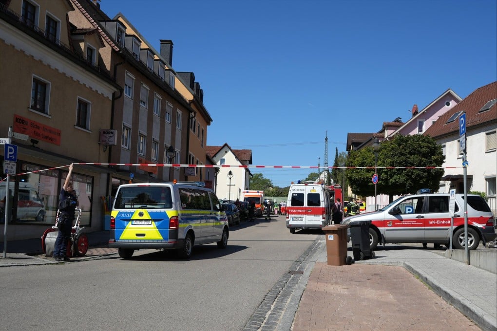 Police officers cordon off a wide area around the train station in Middle Franconia, where a technician had discovered the object in the track bed at the entrance to the city’s train station. Photo: dpa