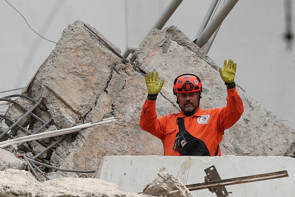 A Mexican rescuer gestures while searching through rubble on Wednesday, two days after an earthquake struck Cali, Colombia. Photo: AP