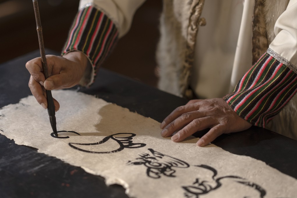 Dongba script, the world’s only hieroglyphic script still in use today, was created by Naxi shamans for sacred rituals. Photo: Amandayan