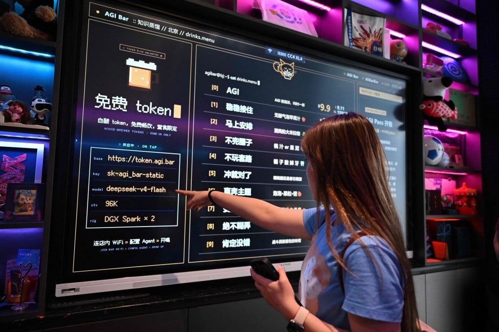 A customer looks at a board with the menu at AGI Bar in Beijing’s Zhongguancun district on August 9. AI users are shopping around as US giants face fierce competition from Chinese rivals -- and in Beijing’s tech district, customers at an AI-themed bar can even plug into DeepSeek for free. Photo: AFP
