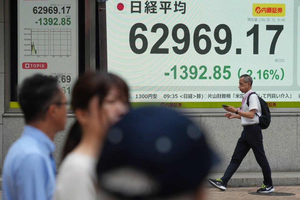 An electronic board showing the US dollar and Japanese yen exchange rate at a securities firm in Tokyo on August 3. Photo: AP