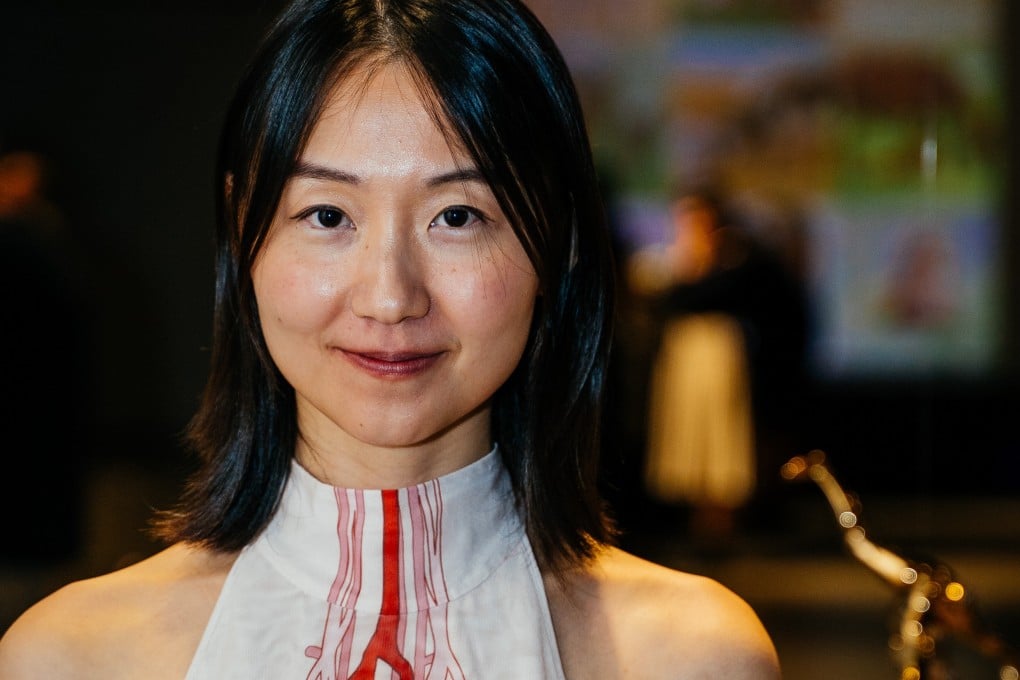 Artist Jiabao Li at her solo exhibition “Womb Wetware” at San Francisco’s Tiat Gallery. Photo: Daniel Clayton