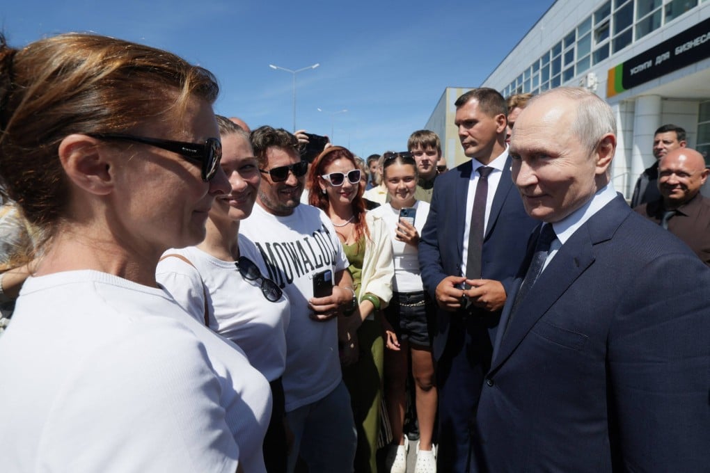 Russia’s President Vladimir Putin interacts on August 13 with local residents on Iturup island, one of four islands in the contested chain known as the Kuril Islands. Photo: AFP