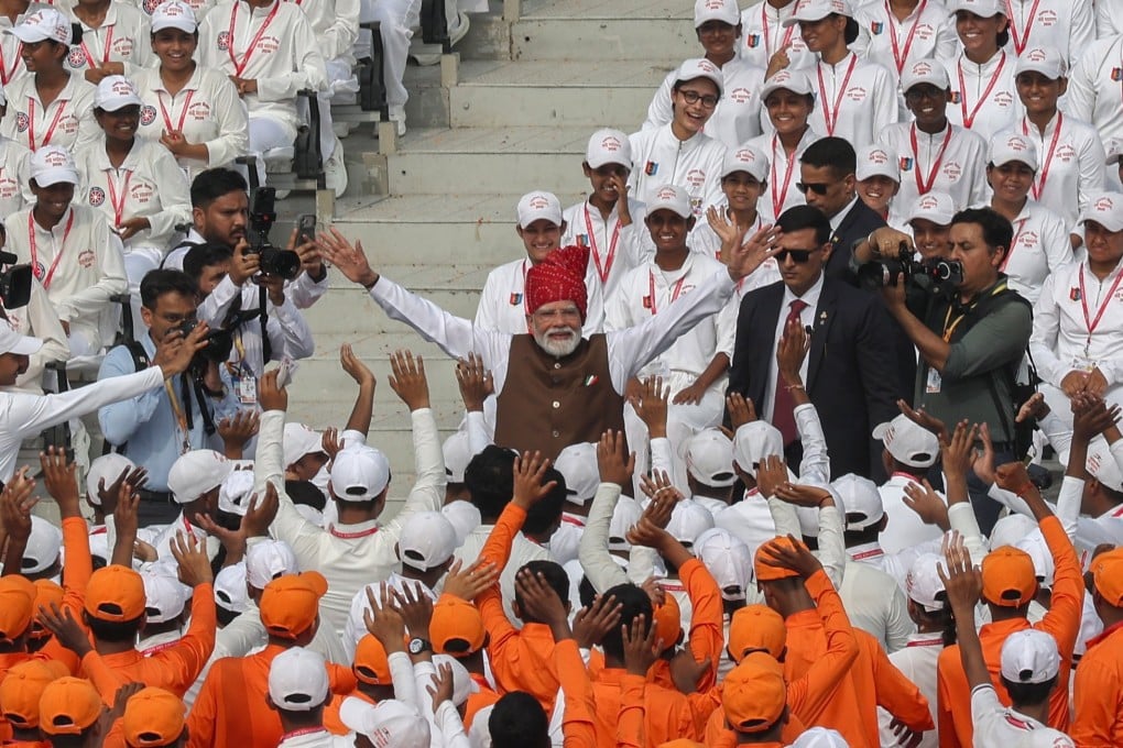 Indian Prime Minister Narendra Modi (middle) greets school children after addressing the nation during Independence Day celebrations at the Red Fort in New Delhi on Saturday. Photo: EPA