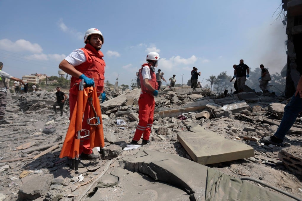 First responders search the rubble following an Israeli air strike on a house in a tourist area of Ansar, southern Lebanon, before dawn on Saturday. Photo: , dpa