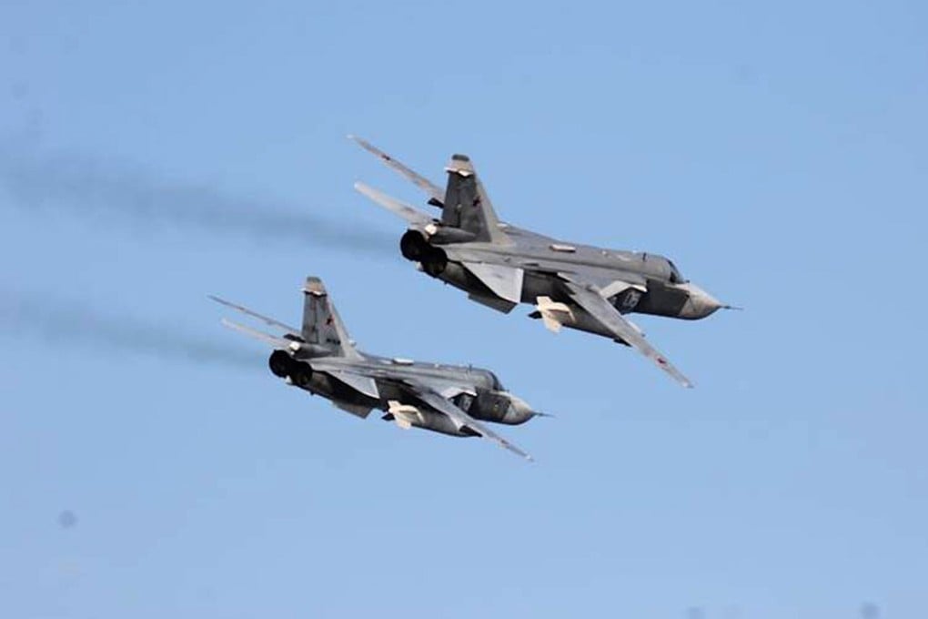Two Russian Sukhoi Su-24 attack aircraft are seen in the Baltic Sea in April 2016. The Iranian pilots were also flying Su-24s. Photo: US Navy via AP,