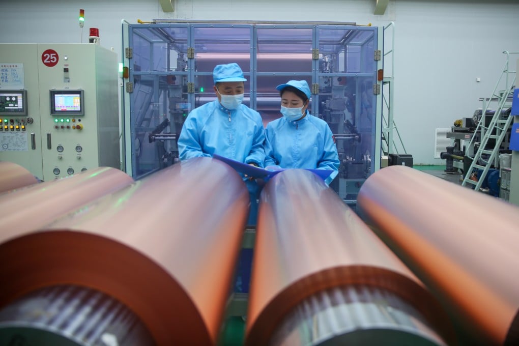 Employees work on a production line for lithium-ion battery copper foil at Lingbao Baoxin Electronic Science and Technology in Sanmenxia, in central China’s Henan province, on April 17. Photo: VCG via Getty Images