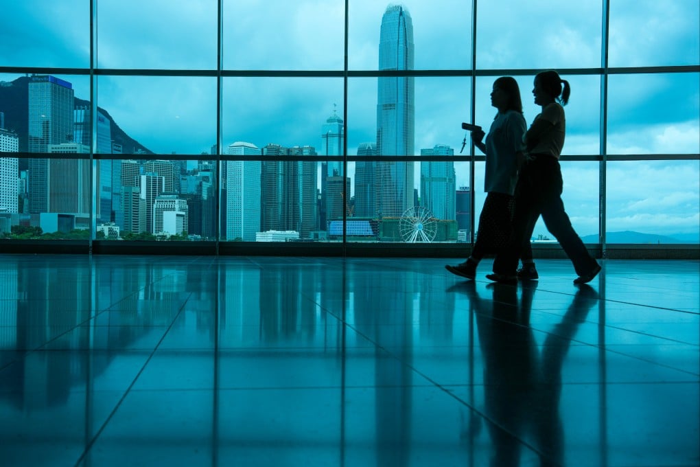 Visitors walk inside Hong Kong Convention and Exhibition Centre in Wan Chai. Photo: Sam Tsang