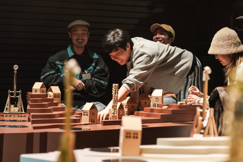 Audience members take part in theatre director Jing Wong’s latest project, When the World is Your Enemy, at The Room at the West Kowloon Cultural District in March 2026. An “epic edition” of the production, which fuses game mechanics with live performance, will be staged at WestK’s The Box in September and October 2026. Photo: WestK