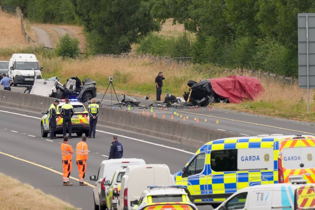 Emergency responders at the scene in County Kildare, Ireland on Sunday, where a number of people have died and others have been seriously injured after a head-on collision between two cars. Photo: PA Wire / dpa