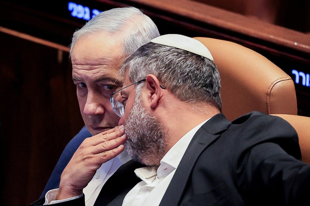 Israel’s Minister of National Security Itamar Ben-Gvir speaks to Prime Minister Benjamin Netanyahu during a parliamentary session on July 16. Photo: Reuters