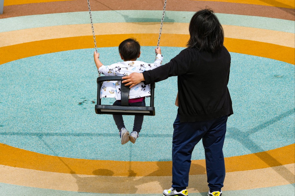 Parents and children play at a playground in Kai Tak Sports Park. Photo: Jelly Tse