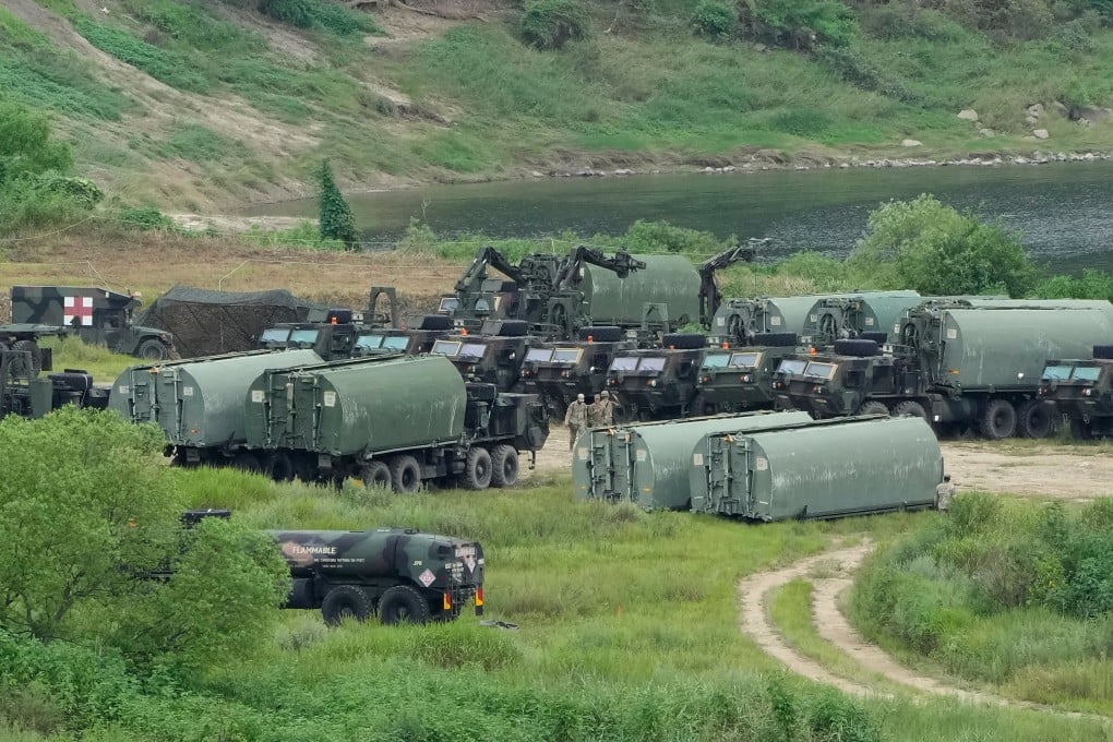 US Army armoured vehicles gather to cross a river at a training field in Yeoncheon, South Korea, near the border with North Korea, on August 17. Photo: AP