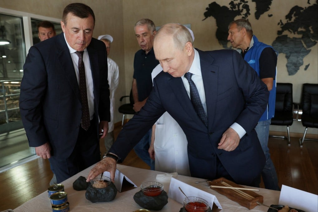 Russian President Vladimir Putin during his visit to the Yasny fish processing complex on the Kuril Island of Iturup on Thursday. Photo: Sputnik / Gavriil Grigorov / Pool via Reuters