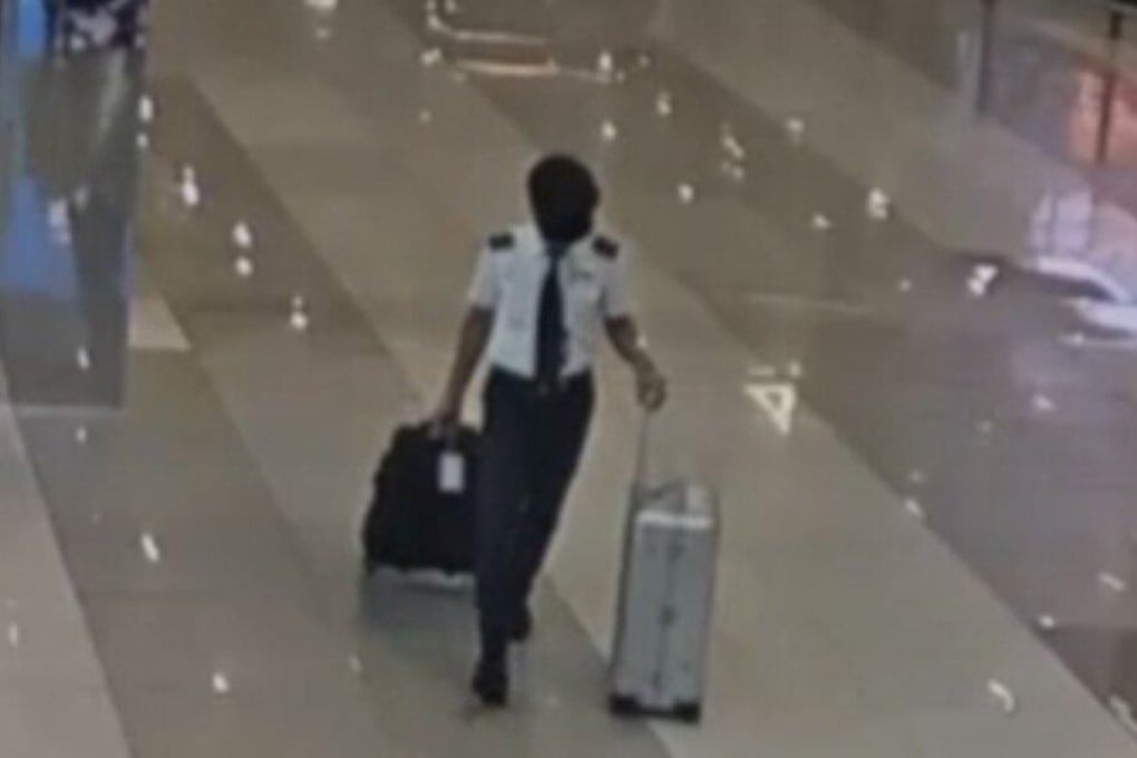 A Malaysia Airlines pilot is seen on CCTV wheeling two bags, later found to contain drugs, at Jakarta's Soekarno-Hatta International Airport on July 28. Photo: Handout
