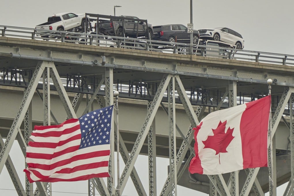 A truck with vehicles crosses the Blue Water Bridge border from Ontario, Canada, into the US in April 2025. Photo: TNS