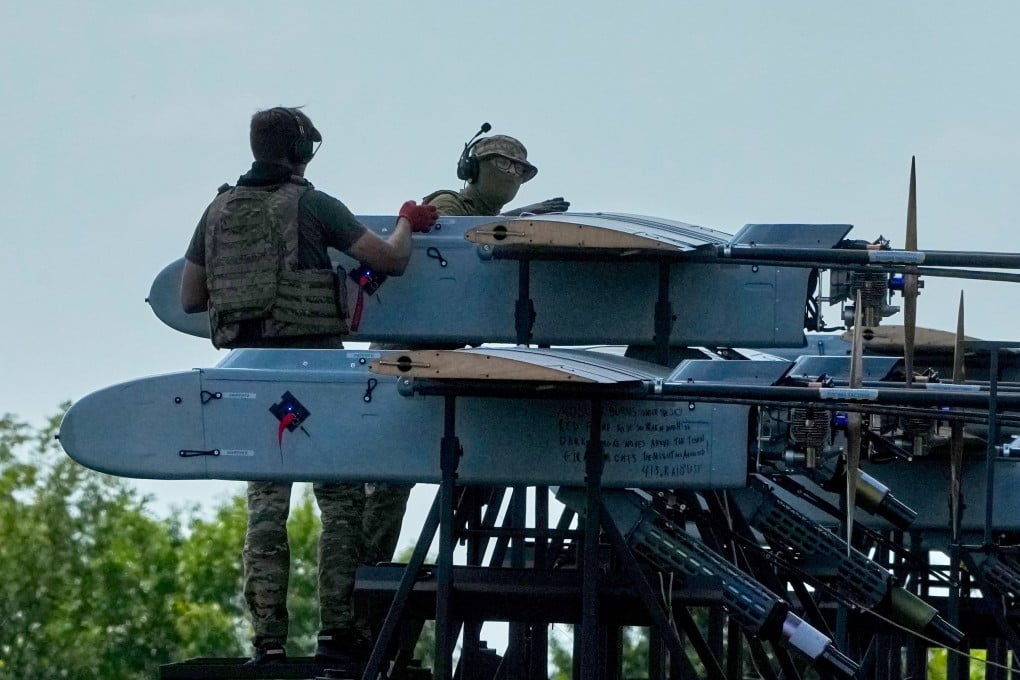 Ukrainian soldiers prepare long-range attack drones for a mission to hit Russian targets on Sunday. Photo: AP