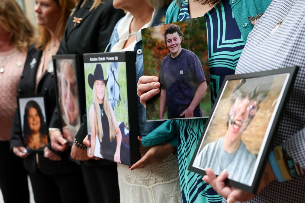 People hold photos of children and young adults whose deaths were related to social media use, as Meta faces a landmark trial in Oakland, California, on Tuesday. Photo: Reuters