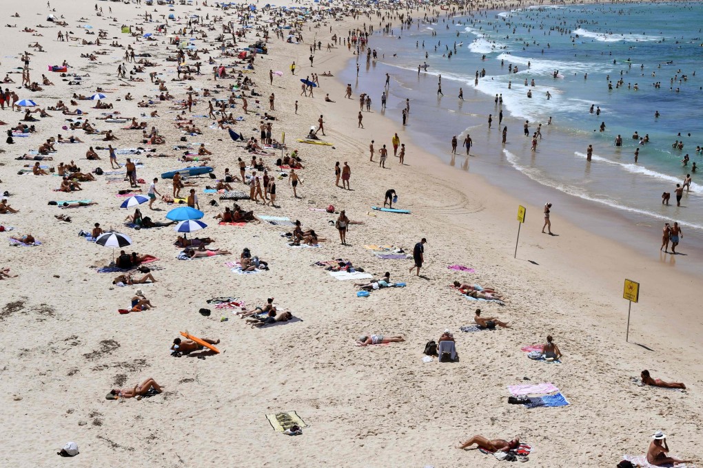 Beachgoers relaxing on Sydney’s Bondi Beach. Melanoma is one of the deadliest forms of skin cancer. Photo: AFP