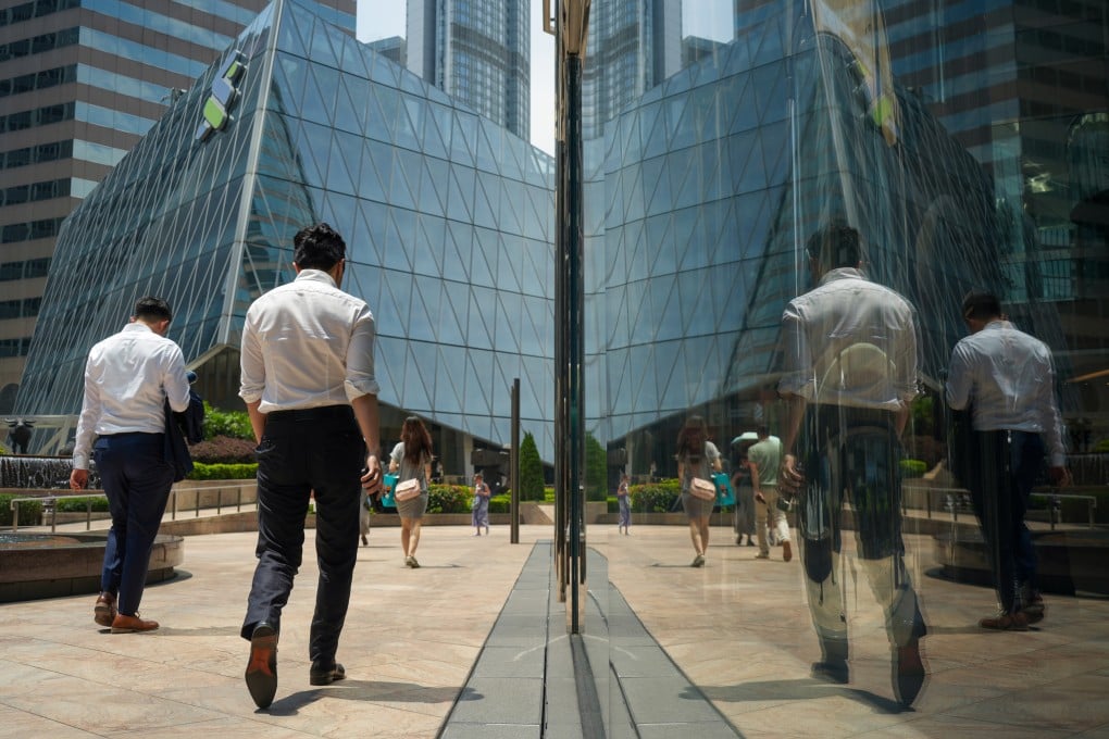 People walk past buildings in Central, Hong Kong. Photo: Sun Yeung
