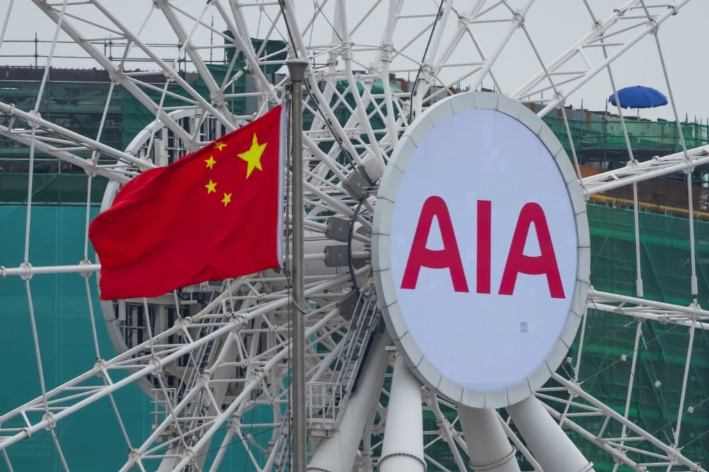 The AIA logo on the Hong Kong Observation Wheel sits next to China’s national flag. Photo: Getty Images