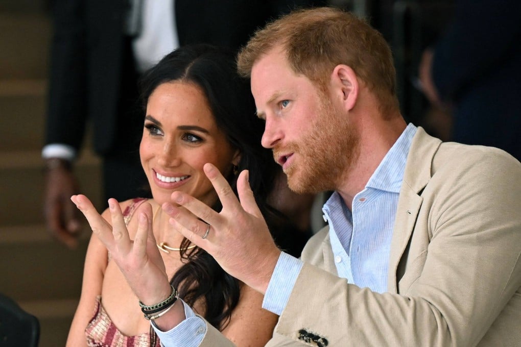 Britain’s Prince Harry speaks with his wife, Meghan Markle, while attending a show during a visit to the National Centre for the Arts in Bogota in August 2024. Photo: AFP