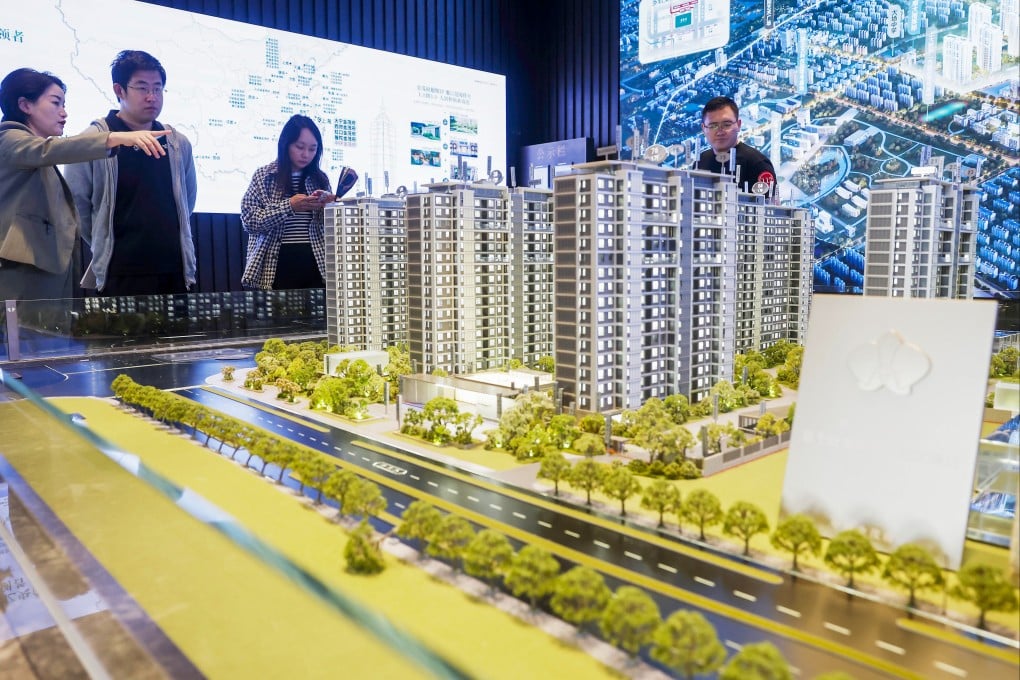 Potential buyers view property models at a real estate sales office on October 2, 2024, in Shanghai. Photo: Getty Images