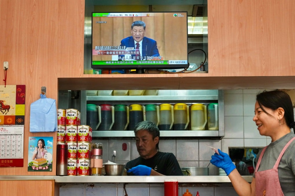 An event marking the 105th anniversary of the Communist Party of China is shown live on television in a cha chaan teng in Wan Chai on July 1. When people value a cha chaan teng, wet market or familiar streetscape, they may not be rejecting what Hong Kong is becoming. They may simply be trying to preserve some continuity with what came before. Photo: Karma Lo