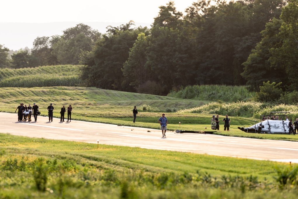 Authorities investigate a crash between a state police helicopter and a small plane at the Carlisle airport in Pennsylvania, the US on Wednesday. Photo: via AP