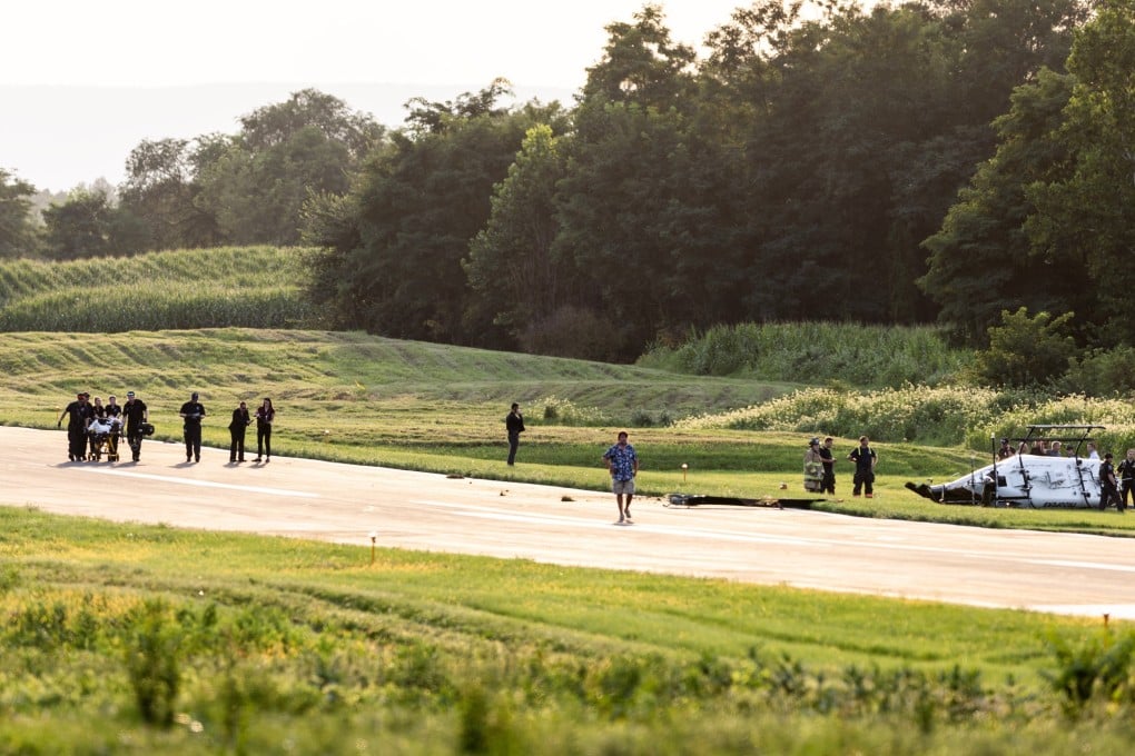 Authorities investigate a crash between a state police helicopter and a small plane at the Carlisle airport in Pennsylvania, the US on Wednesday. Photo: via AP