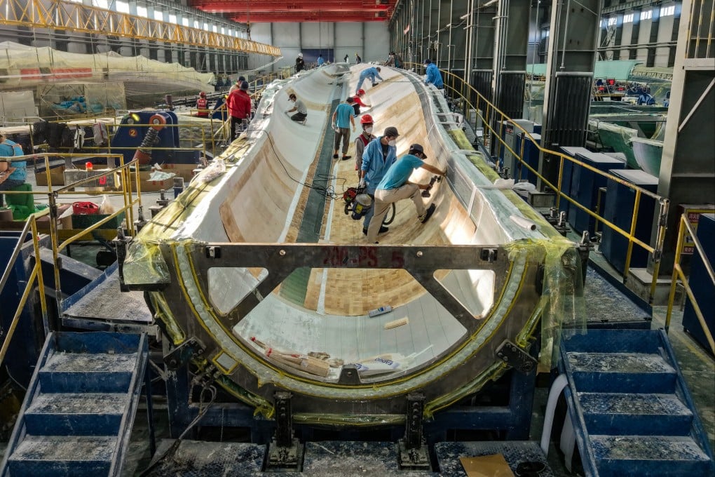 Workers make wind turbines at a factory in Jiuquan, Gansu province, last year. Photo: Xinhua