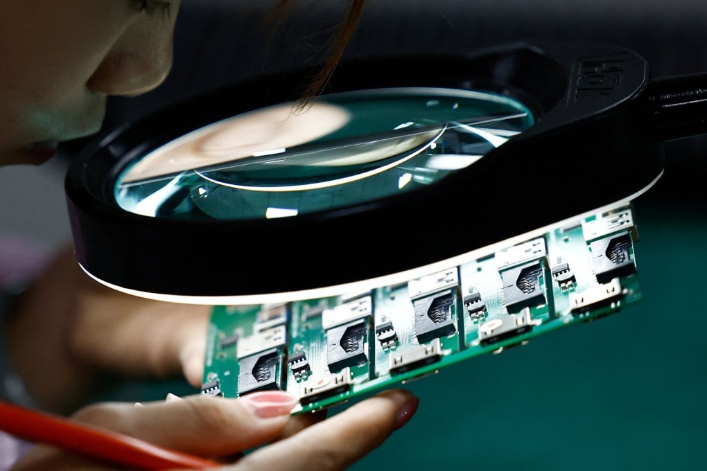 Printed circuit boards are inspected at a factory in Dongguan, Guangdong province, China. Photo: Reuters