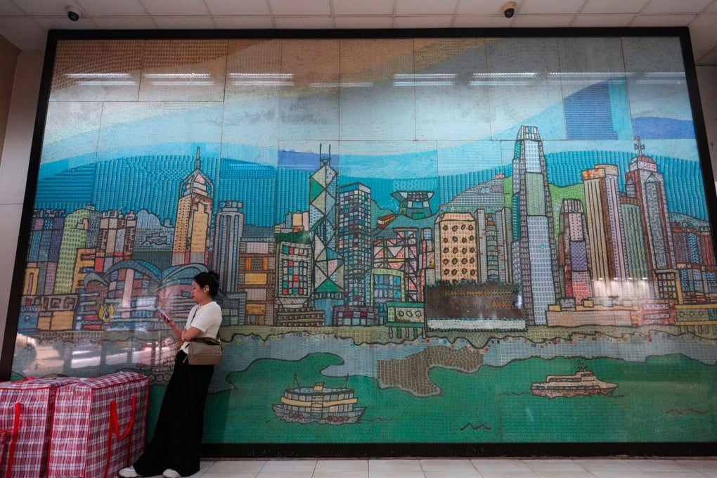A woman waits at the General Post Office in Central, Hong Kong. Hongkong Post has recorded a loss for eight consecutive years. Photo: Jelly Tse