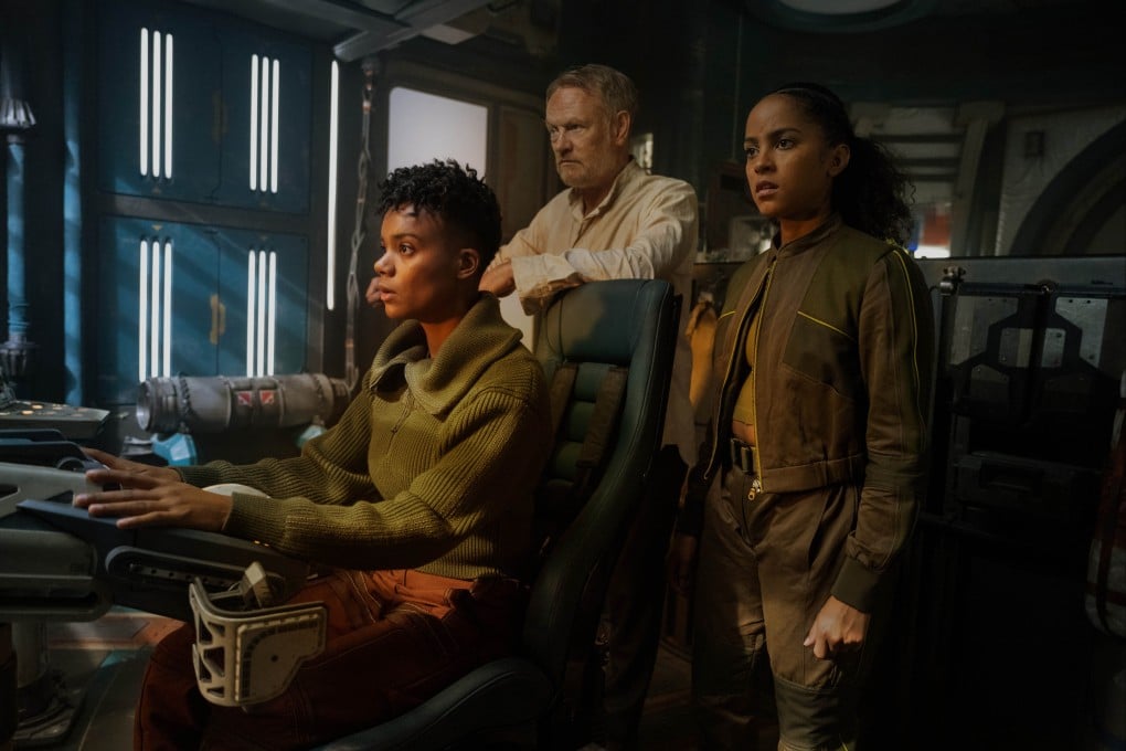 Actor Jared Harris (centre) plays mathemetician Hari Seldon, seen here with Leah Harvey and Lou Llobell, in the Foundation TV series. Photo: Apple TV+