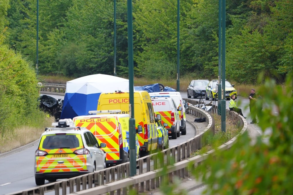 Police officers at the scene of a fatal crash involving a police car and a Volkswagen in South Bank, near Middlesbrough, England, UK on Saturday. Photo: PA via AP