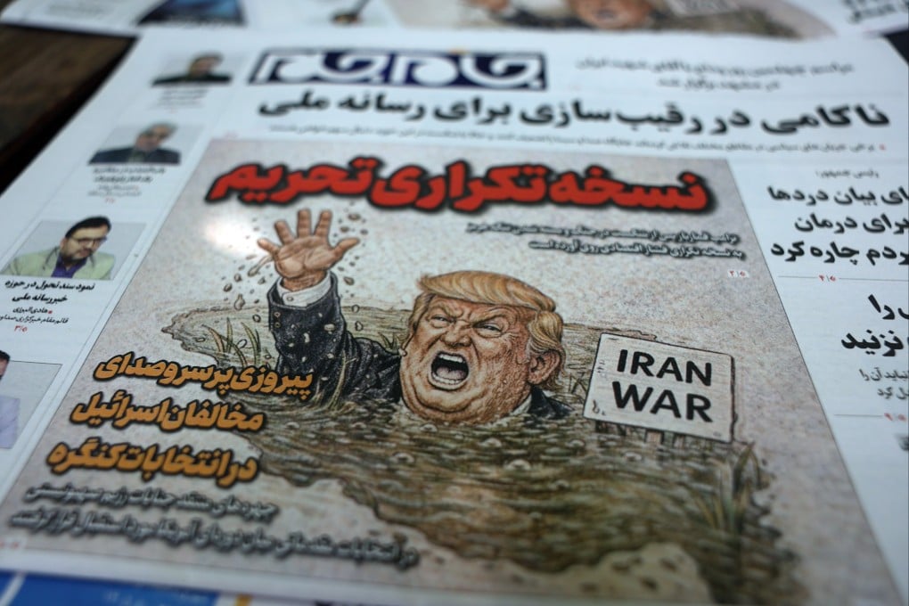 The Iranian newspaper Jame-Jam with a cartoon of US President Donald Trump, the title reading in Persian “Duplicated Sanctions version”, outside a kiosk in Tehran, Iran on Saturday. Photo: EPA