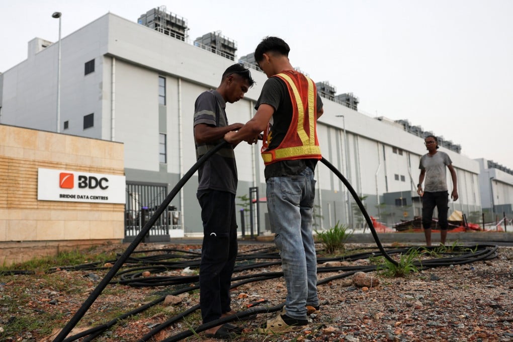 Workers lay cables outside Bridge Data Centres in Johor state, which has become Southeast Asia’s fastest-growing data centre hub, in Sedenak, Malaysia, on May 6. Photo: Reuters