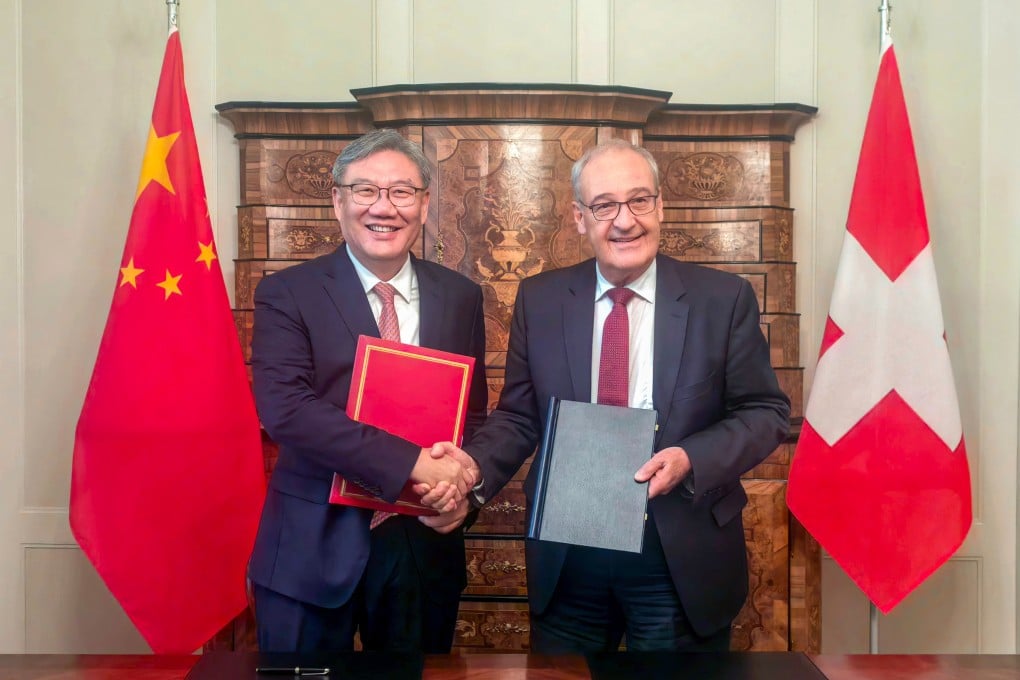 Commerce Minister Wang Wentao and Swiss President Guy Parmelin clinched the FTA expansion deal in talks in Bern on Thursday. Photo: Handout