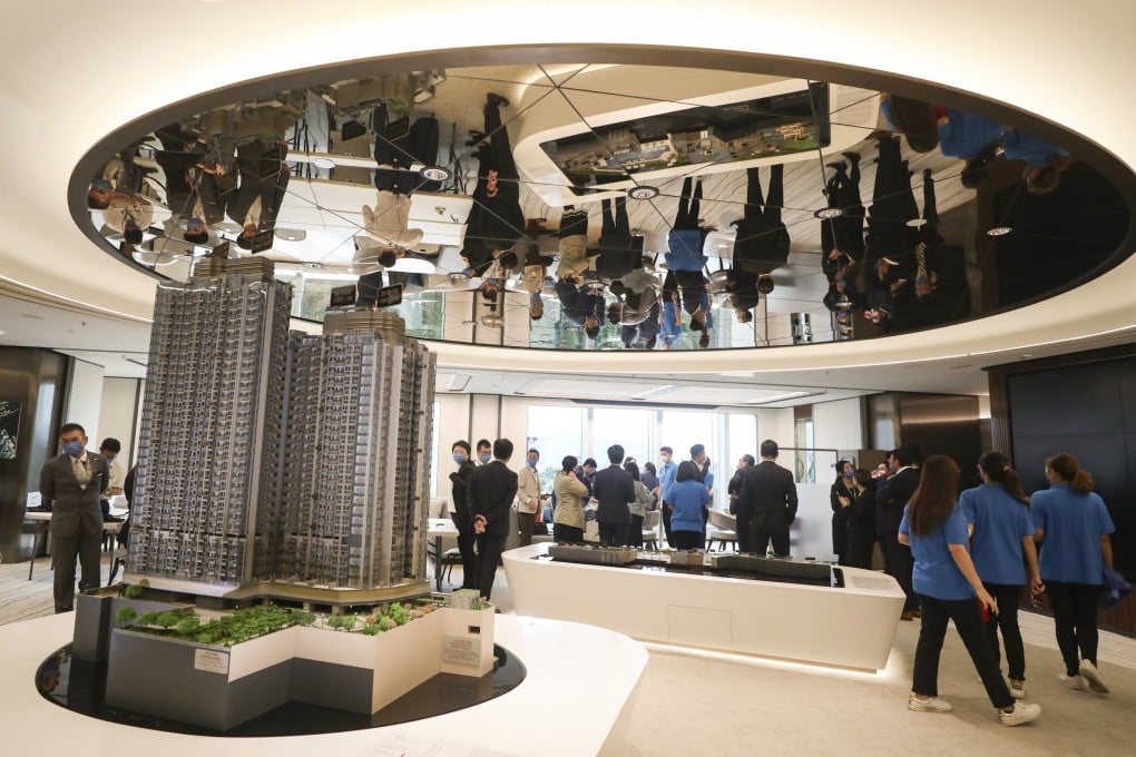 Potential buyers view a model of the La Marina project, jointly developed by Kerry Properties and Sino Land, in this file photo from September 11, 2021. Photo: Xiaomei Chen
